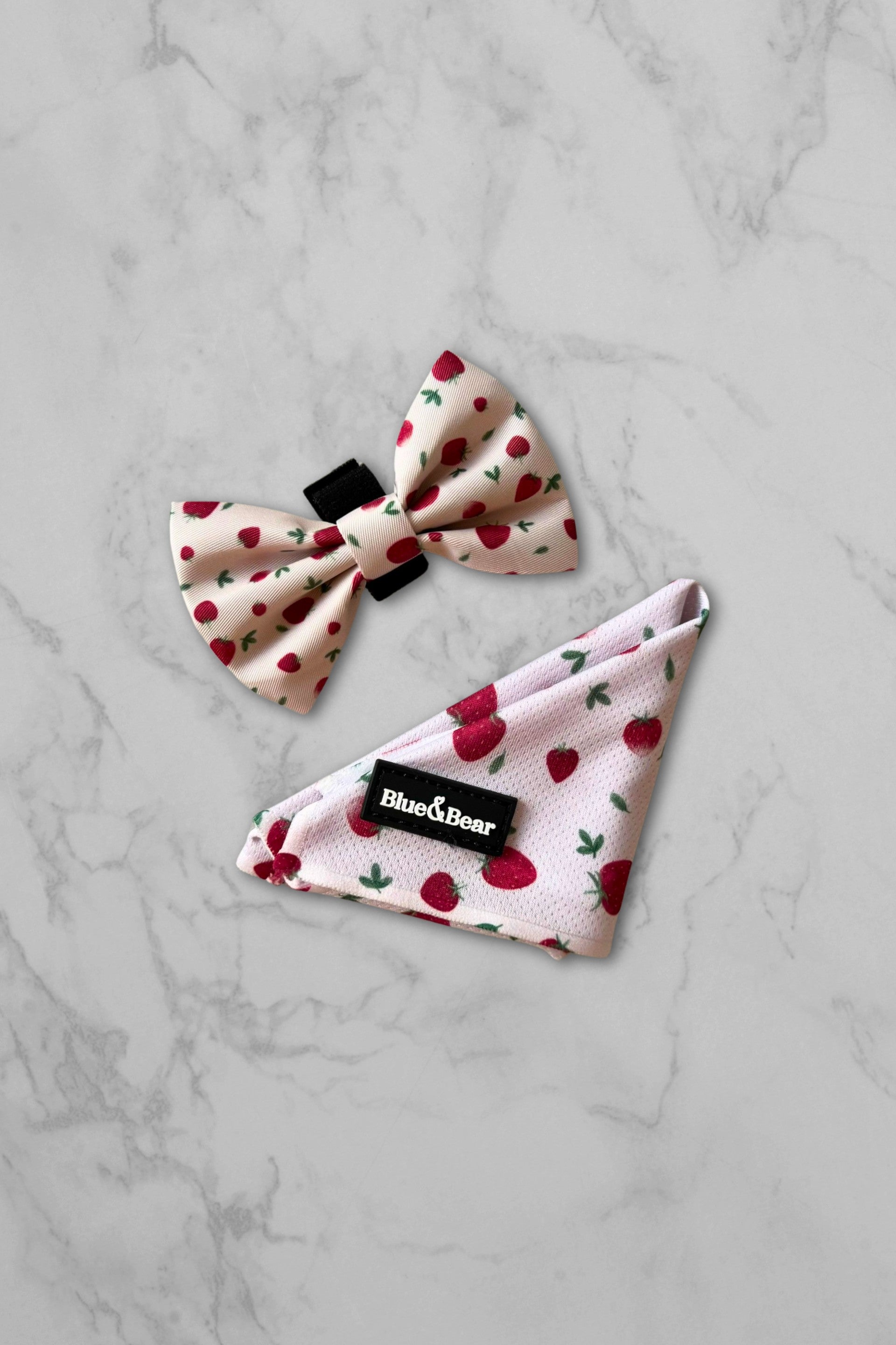 Pink dog bandana with strawberry pattern and matching bow tie